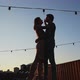 Couple Kissing While Standing on Rooftop During Sunset - VideoHive Item for Sale