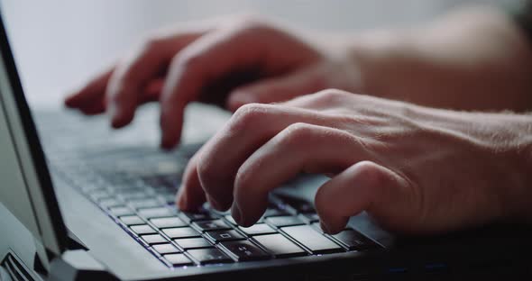 Business - Businessman Hands Type on Laptop Computer Close Up