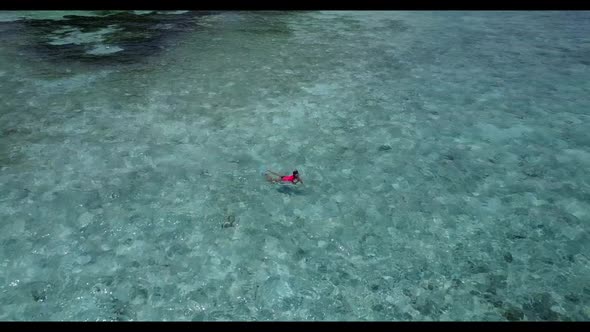 Aerial sky of marine coastline beach journey by turquoise ocean with white sand background of a dayo