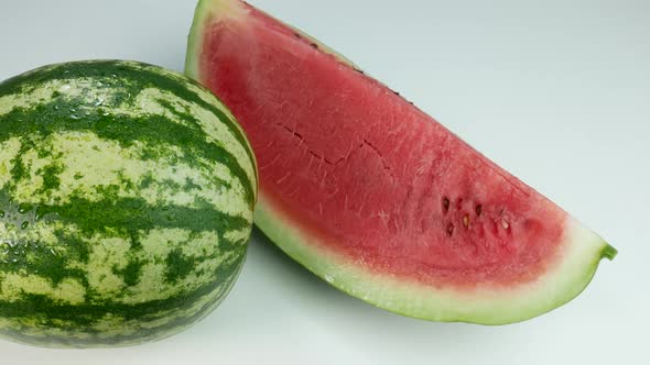 Watermelon And A Delicious Slice On White Surface