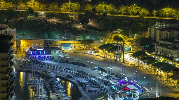 Cityscape of Monte Carlo Monaco Night Timelapse with Yachts and Traffic on Embankment