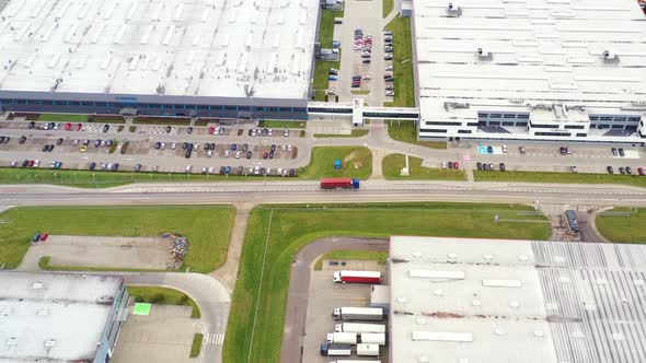 Aerial view of goods warehouse. Logistics center in industrial city zone from above. Aerial view of