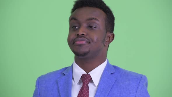 Face of Stressed Young African Businessman Looking Bored and Tired