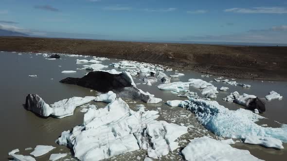 Iceland. Icebergs in a glacial lake. Aerial drone flight over Glacier Lagoon.