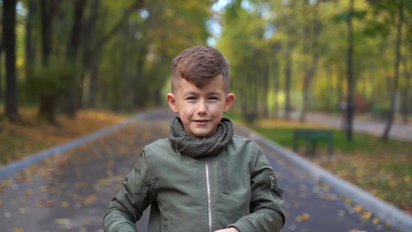 Child Takes Off Protective Medical Mask From Face Showing Thumb Up