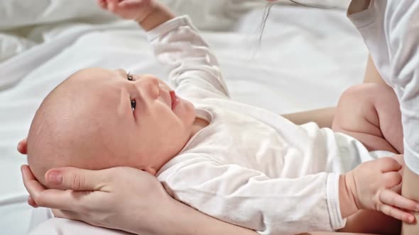 Mother Rubbing Noses with Baby Son