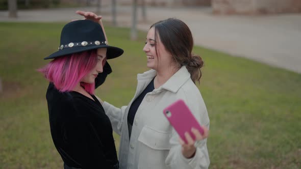 Friends Having Fun and Posing to Make Selfie Photos at the City Park