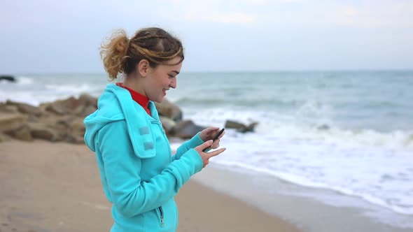 Happy Woman Photographing a Sea Waves