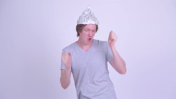 Young Man with Tinfoil Hat Dancing