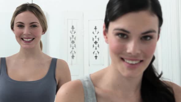 Portrait of two young women in bathroom