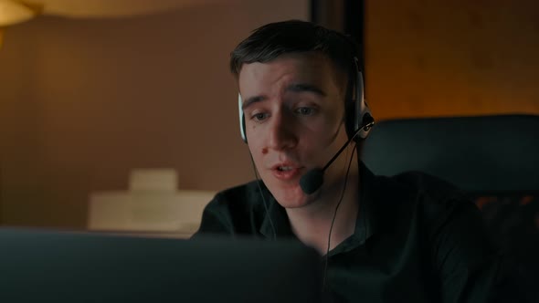 Closeup of Caucasian Man in Headset Helping Client with His Purchase