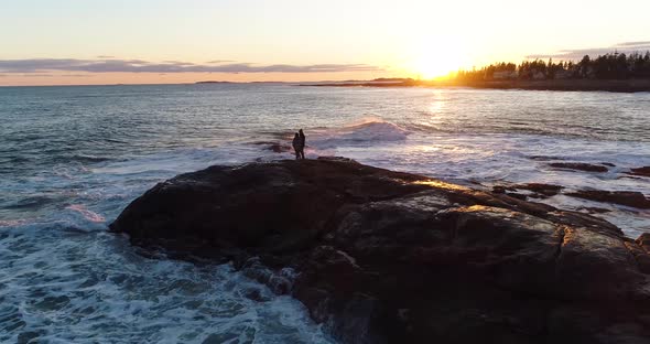 Couple enjoying the sunset in Curtis island lighthouse Camden Maine USA