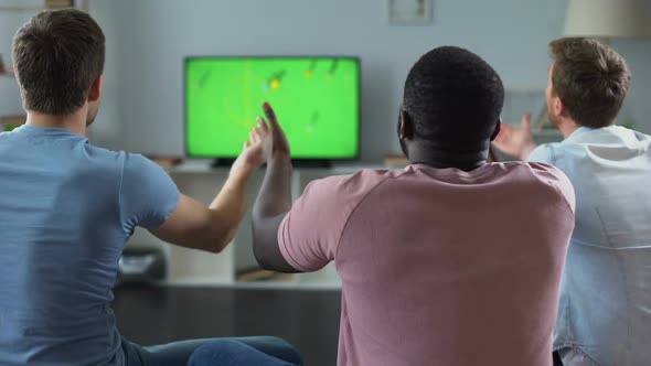 Male Friends Watching Football Match on TV, Fans Supporting National Team