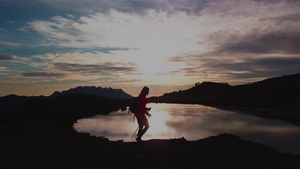 A Girl On A Mountain Hike At Sunset