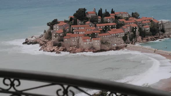 View on the Island of Sveti Stefan on a cloudy day. Montenegro, the Adriatic Sea, the Balkans.