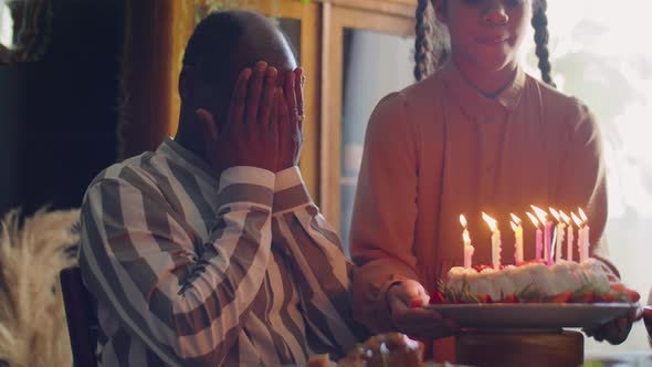 Joyous African American Man Celebrating Birthday with Family