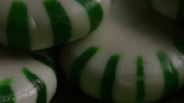 Rotating shot of spearmint hard candies - CANDY SPEARMINT 051