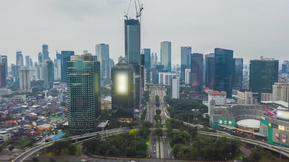 Aerial Hyperlapse Time Lapse of a Busy Traffic in Modern City Center with Skyscrapers Towers and