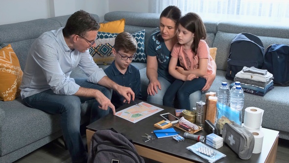 Father explaining to his family the emergency assembly point