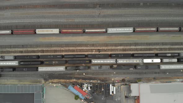 Top Down Aerial of Train Cars Parked in Railway Station