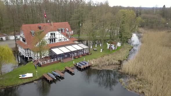 Breathtaking aerial flight fly backwards drone shot of a luxury resort on sticks with jettyspring s