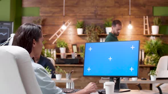 Wide Shot of a Woman Working on a Computer with Isolated Mock-up