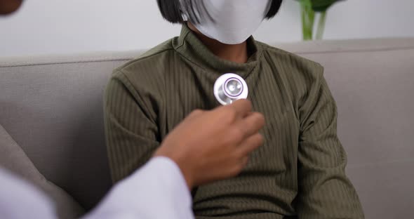 Doctor using stethoscope listen to the heart of girl in the clinic