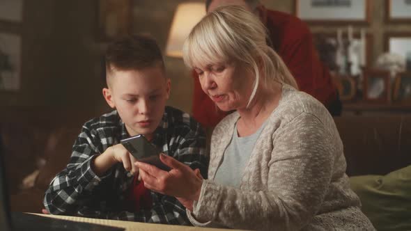 Teenager and Grandmother in Smartphone