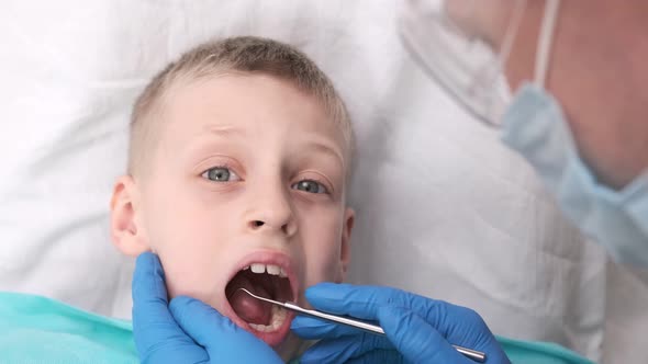 The Dentist Examines the Child