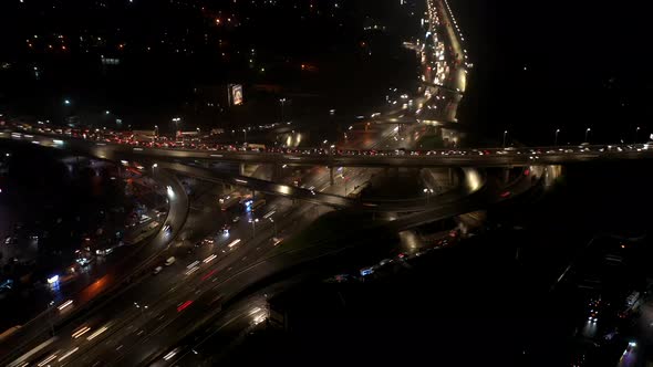 Aerial View of Highway Interchange at Night Timelapse