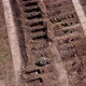 Open Graves Near A City Drone - VideoHive Item for Sale