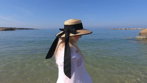 Woman Travel to Cyprus and Relax Near Coral Bay Beach