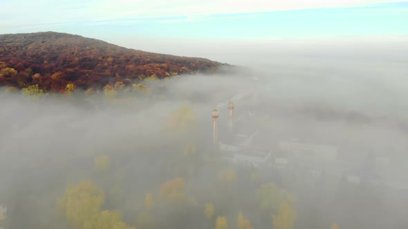 View of the Plant and the Pipes Covered with Morning Fog, Flight Over the City of Lviv in Ukraine