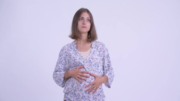 Stressed Young Pregnant Woman Looking Bored and Tired