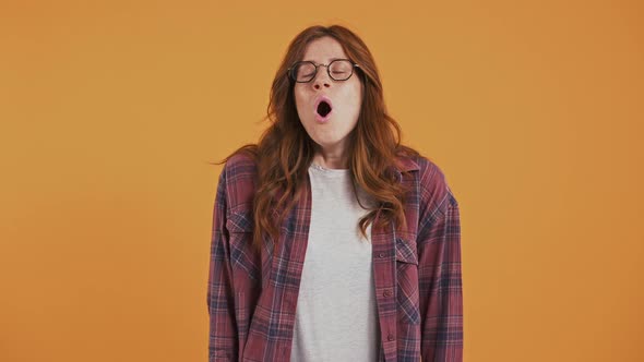 Ginger Adolescent Girl with Freckles in Checkered Shirt and Glasses