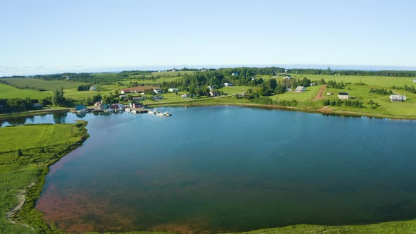 Approaching small fishing port of French River, Prince Edward Island, Canada. Aerial drone view of l