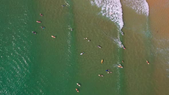 Aerial View Of Surfers Surfing On A Sunny Summer Day In Noosa Heads, QLD, Australia.