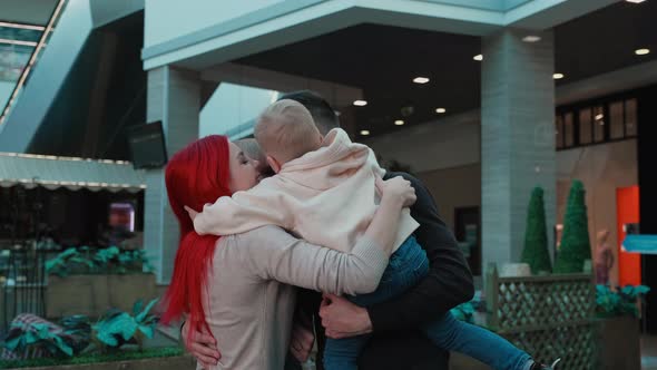 Family Hugging in the Mall