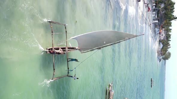 Vertical Video Boats in the Ocean Near the Coast of Zanzibar Tanzania Aerial View