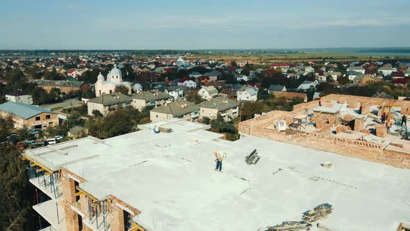 Aerial View Flight Over the Construction of a Multistorey Brick House