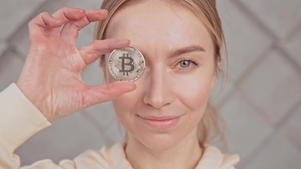 Portrait Young Female with Cryptocurrency