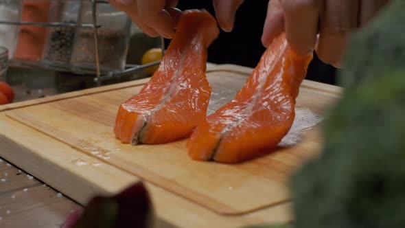 Professional Chef Prepares Fish Steak for Frying