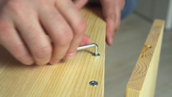 Closeup Hands Assembling Wooden Furniture