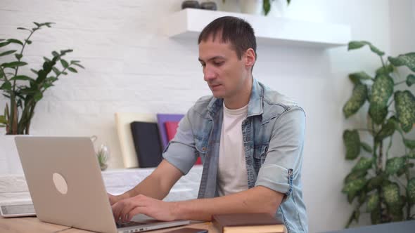 Businessman Working on Laptop Computer at Home Office