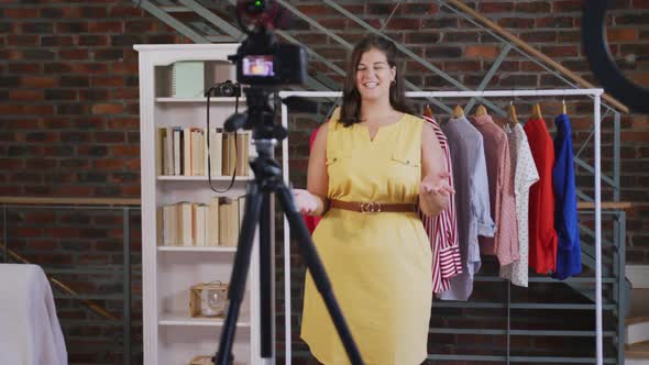 Caucasian vlogger woman doing a fashion video at home