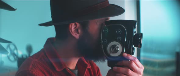 A young man using 35mm film camera