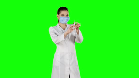 Syringe with a Medicine in a Hand, Green Screen