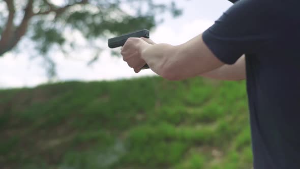 Close-up Shot of a Pistol. Slow Motion.