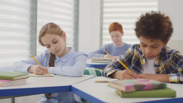 African-American School Boy Coping down during Test