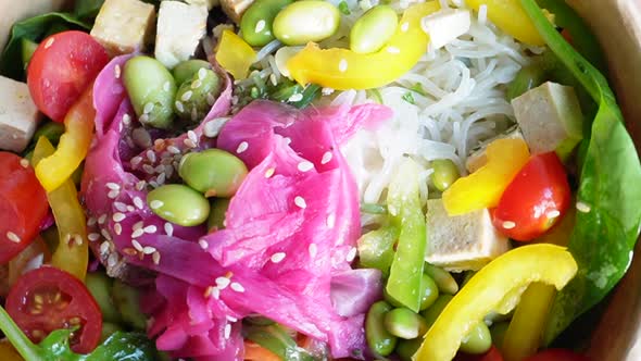 Healthy buddha bowl close up with tofu and salad